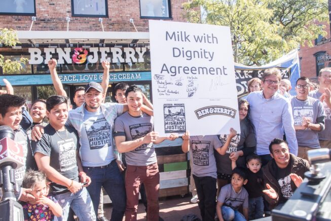 Farmworkers celebrate the signing of the first Milk with Dignity agreement with Ben & Jerry's Ice Cream