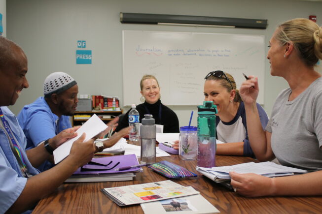 Pollen's editorial director with the first editorial board at the Central California Women's Facility: Sagal Sadiq left front, Kanoa Harris-Pendang left back, Amber Bray, right front, Nora Igova, back right and Kate McQueen back center